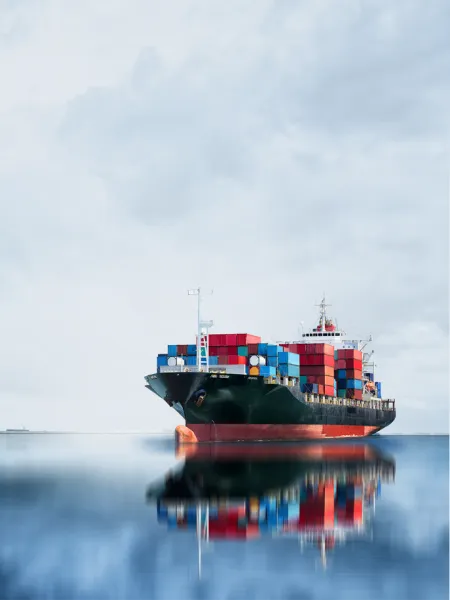 cargo ship on a glassy sea